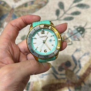 teal and gold Breeze watch with silicon strap